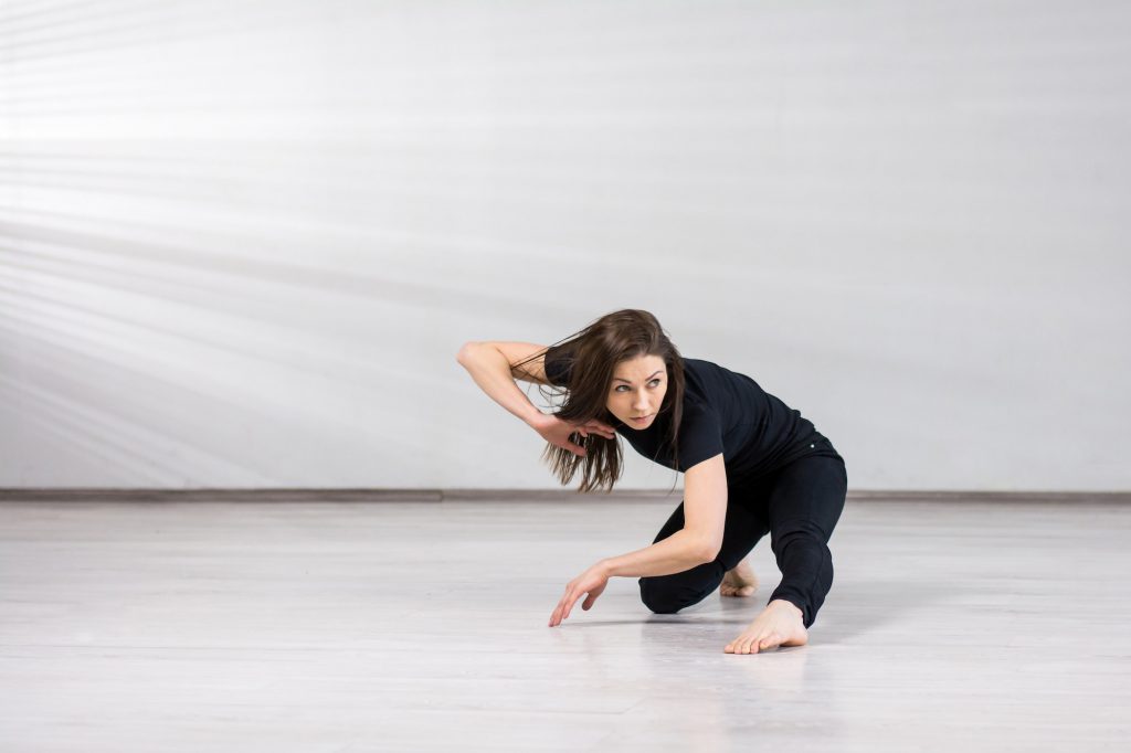 Dancer girl in gymnastic posing.